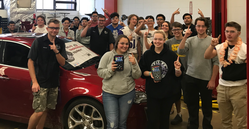 Joel Dufkins, Sheila Stevens and the automotive class at Rolling Meadows High School