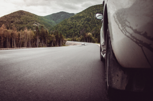 gray car on the side of the road